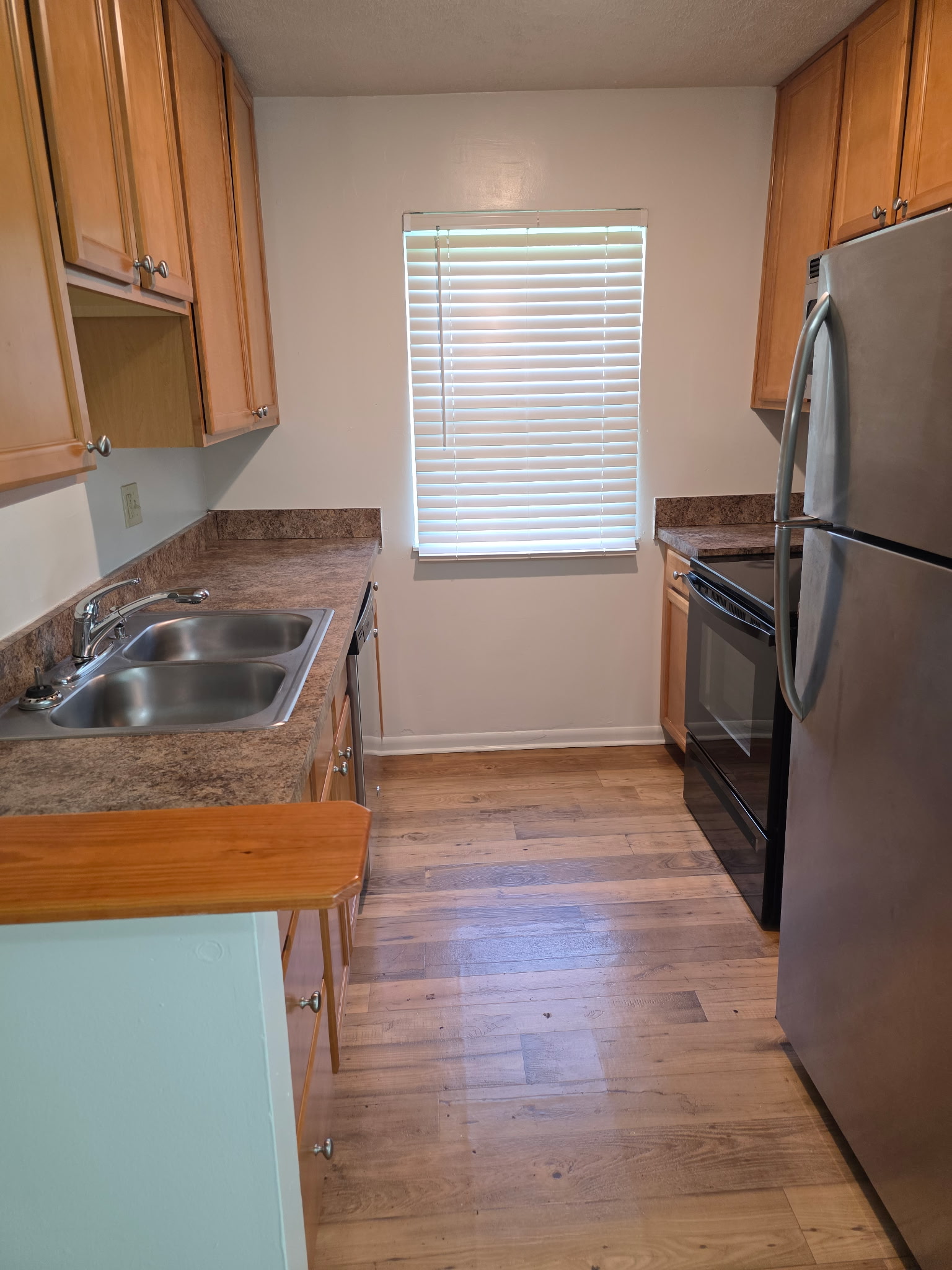 finished kitchen with wood cabinets